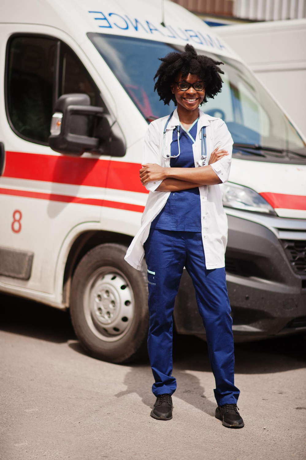 african-american-female-paramedic-standing-front-ambulance-car